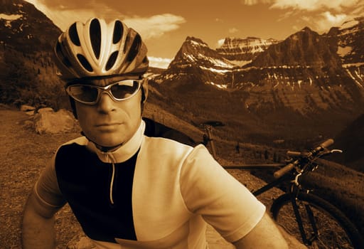 Mountain biker with mountain range backdrop