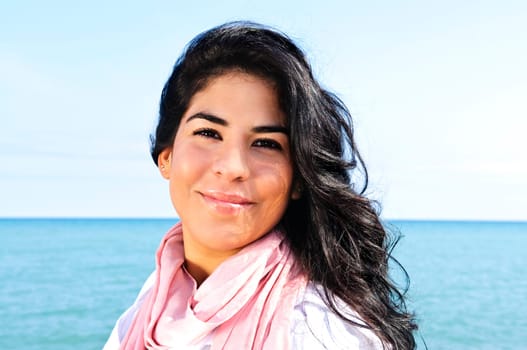 Beautiful young woman at beach