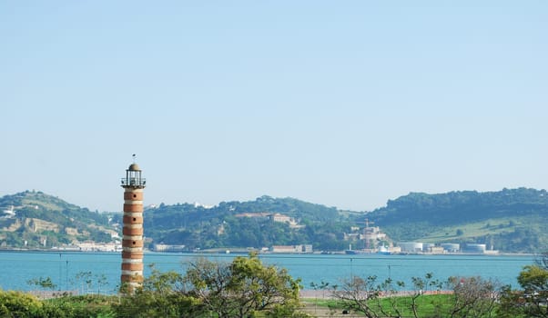 Lighthouse protecting the city over the river