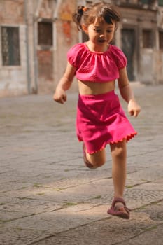 Girl running through street