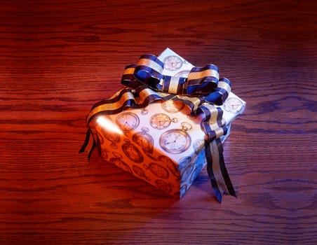 Present with blue and gold bow