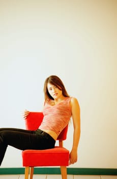 Woman sits on chair