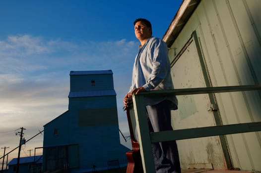 Man looks out at day's work