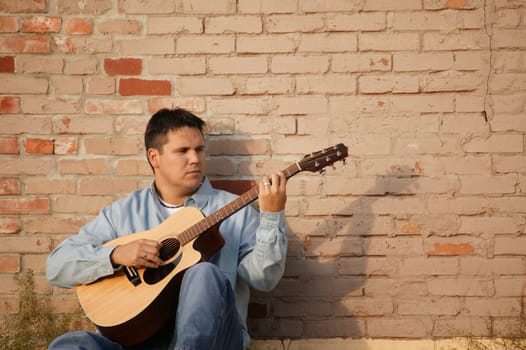 Man plays guitar