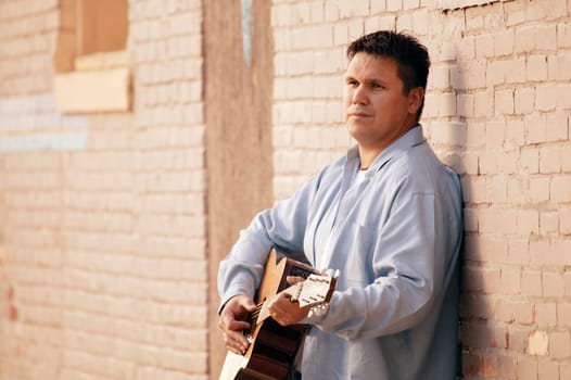 Man plays guitar