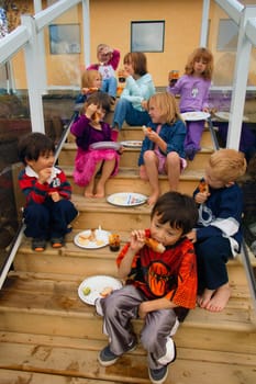 Children eat outside