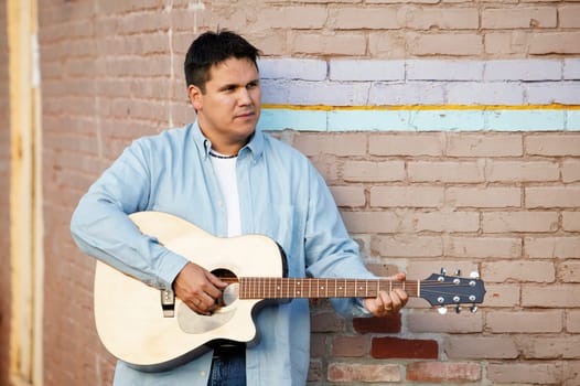 Man plays guitar