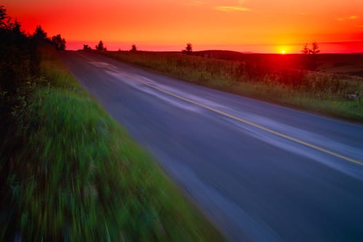 Moving at speed down country road