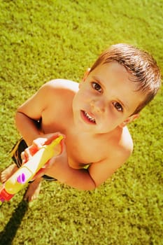 Child plays with water gun