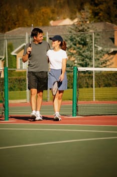 Couple in tennis courts