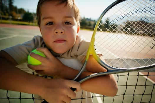 Boy with tennis racket