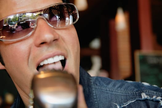 Man singing into a microphone