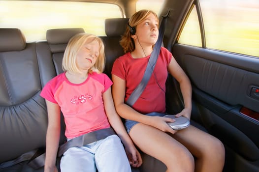 Girls in the back seat of a car