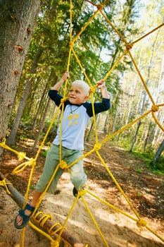 Child climbing ropes