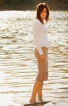 A woman wades in the water