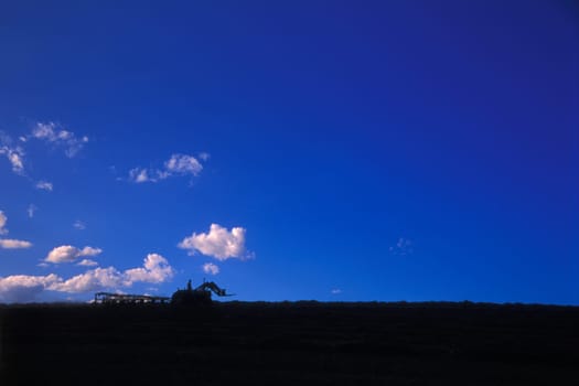 A tractor on the horizon