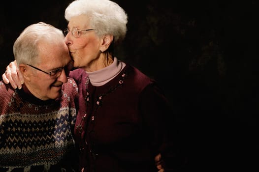 Woman kisses man