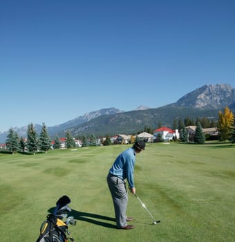 Man playing golf