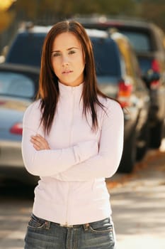 Woman stands on the sidewalk
