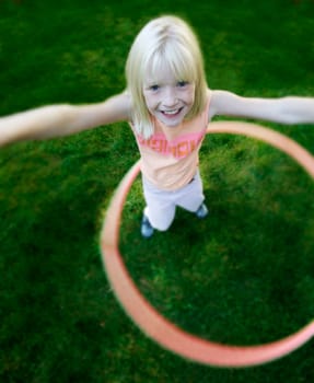 Child plays with hoop