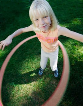 Child plays with hoop