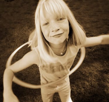 Child plays with hoop