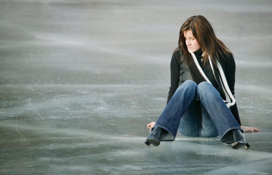 Woman sits on ice