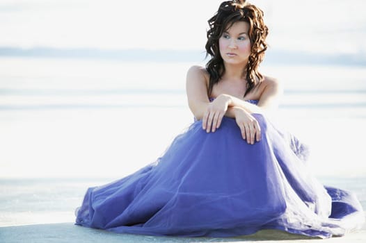A woman with a blue gown