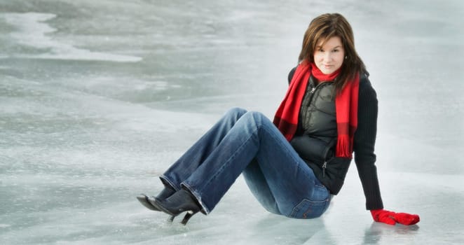 Woman sits on ice