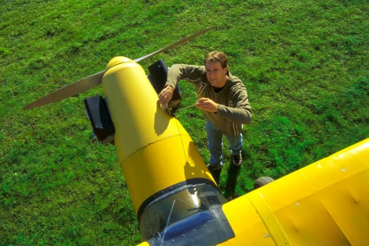 Pilot with his airplane