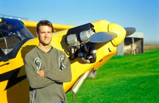 Pilot with his airplane