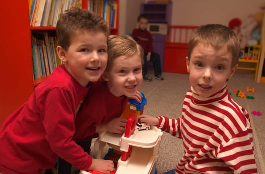 Three boys playing together at preschool
