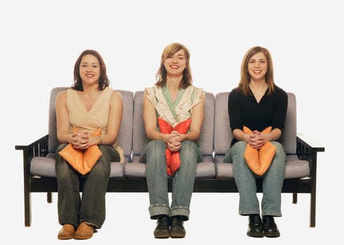 Three women on a sofa