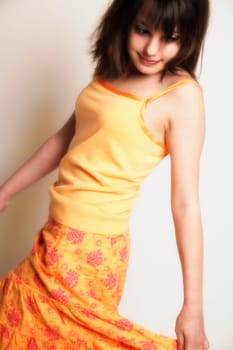 A girl twirls skirt