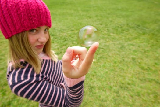 A child holds a bubble