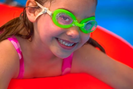Portrait of young girl in swimming pool