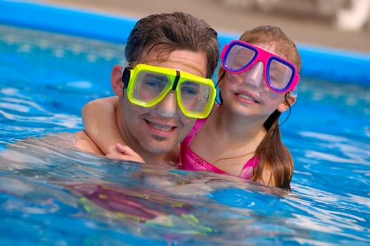 Portrait of father and daughter snorkeling