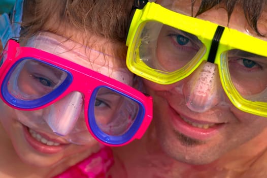 Portrait of father and daughter snorkeling
