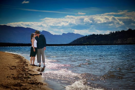 Couple kisses on the beach