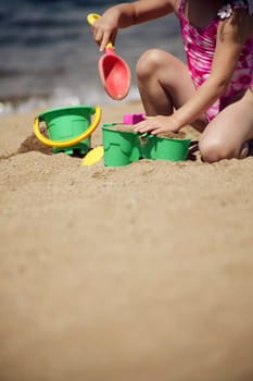 Child playing in the sand