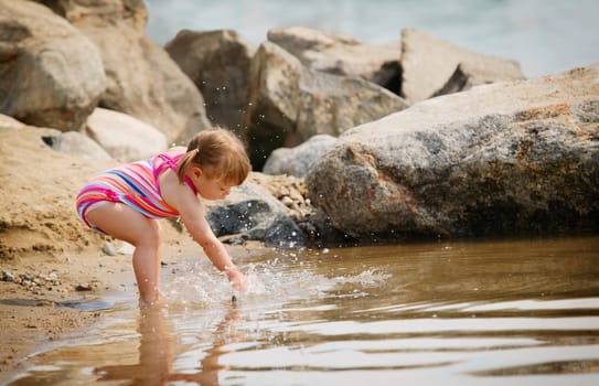 Child splashes in the water
