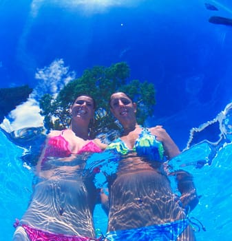 Couple of young women in the pool