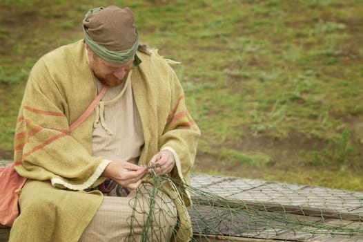 A fisherman working on net