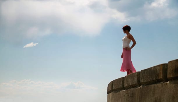 Woman stands on the edge