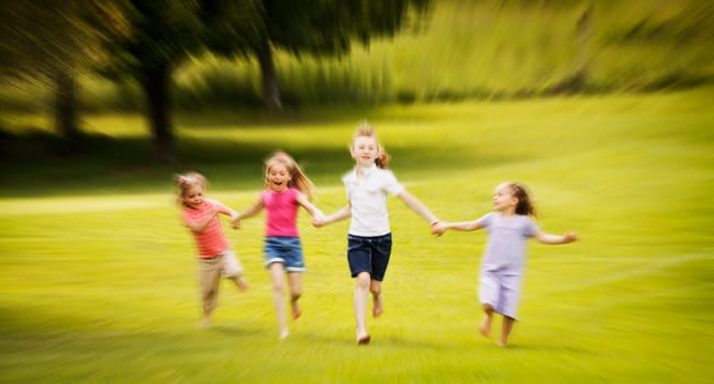 Young girls running in the park