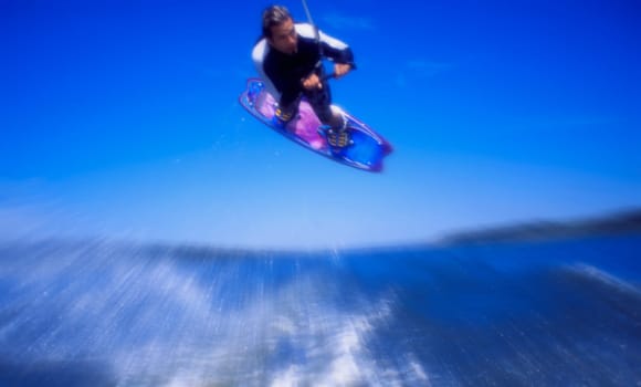 Man wakeboarding Coal Lake Alberta Canada