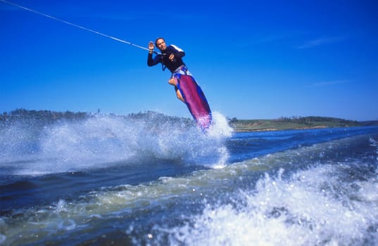 Man wakeboarding on Coal Lake Alberta Canada