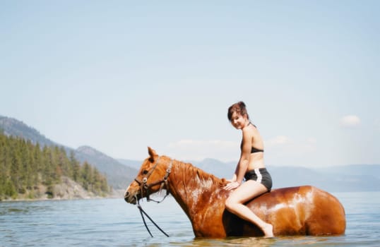 Woman on a horse in the water