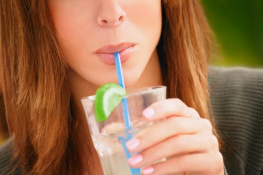 Woman sipping cold drink