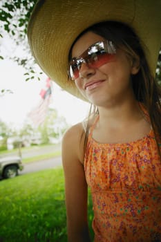 Teen with a hat and sunglasses